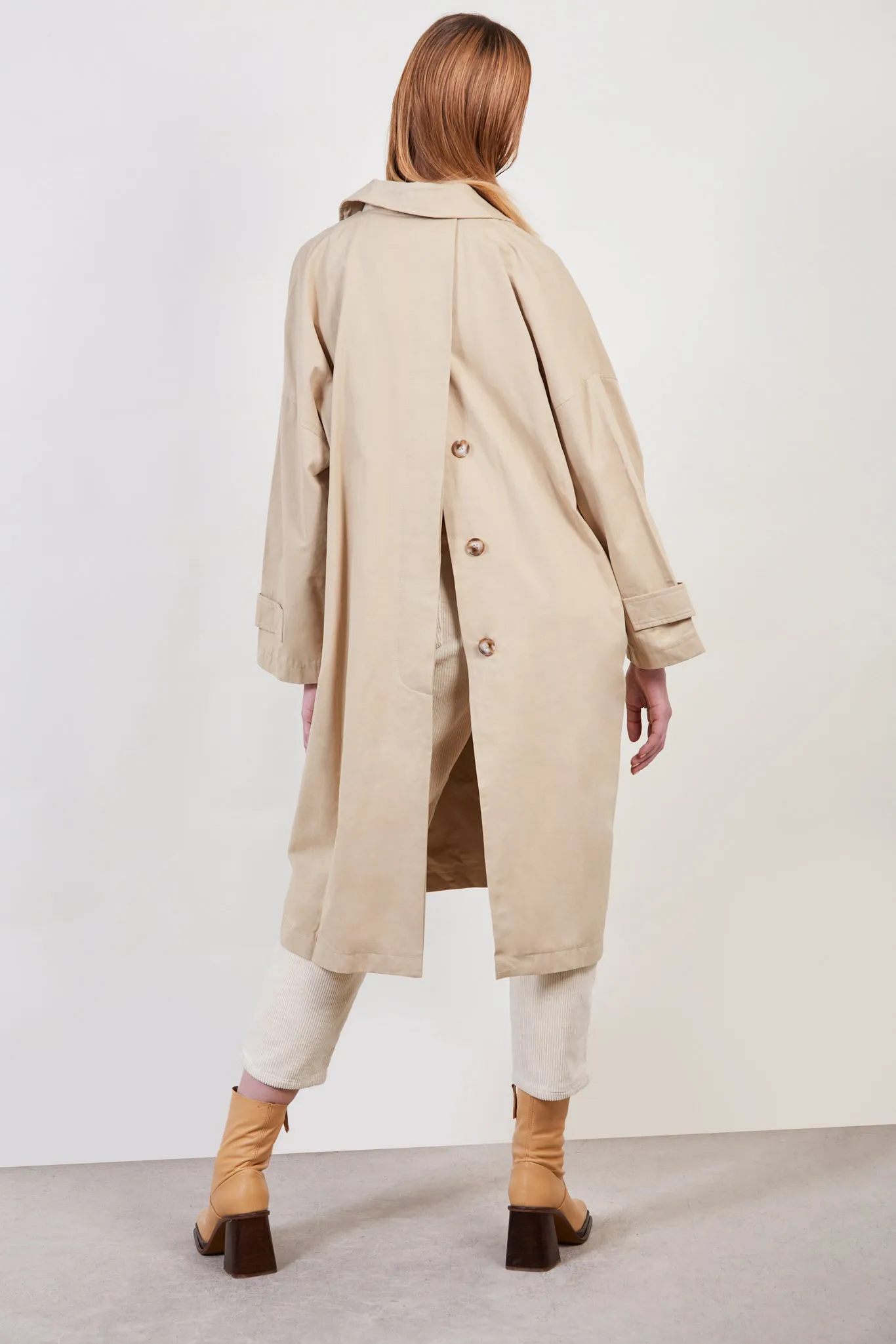 Beige concealed back button trench coat