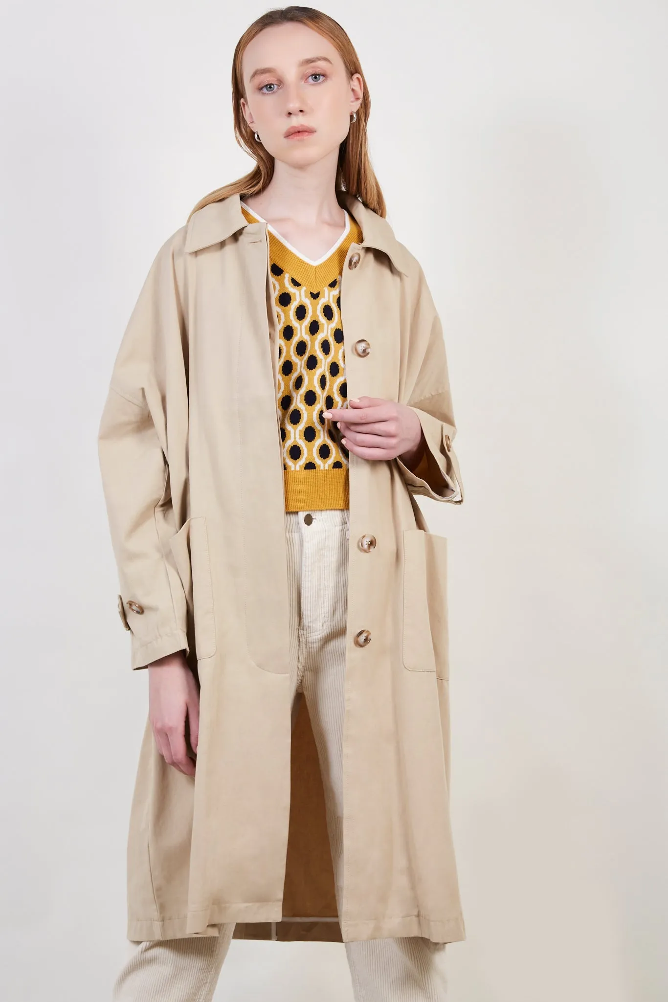 Beige concealed back button trench coat