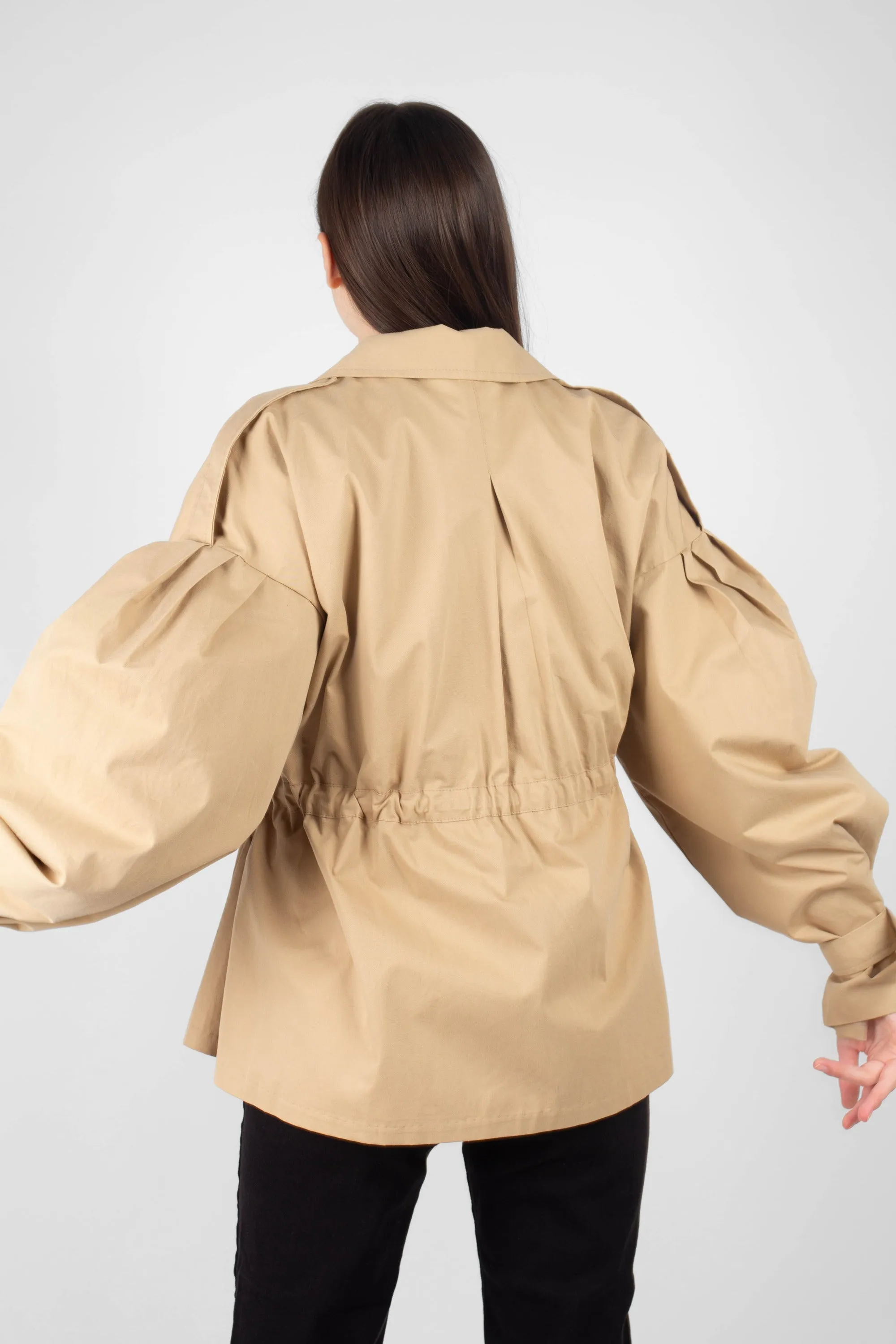 Beige double breasted half length trench coat