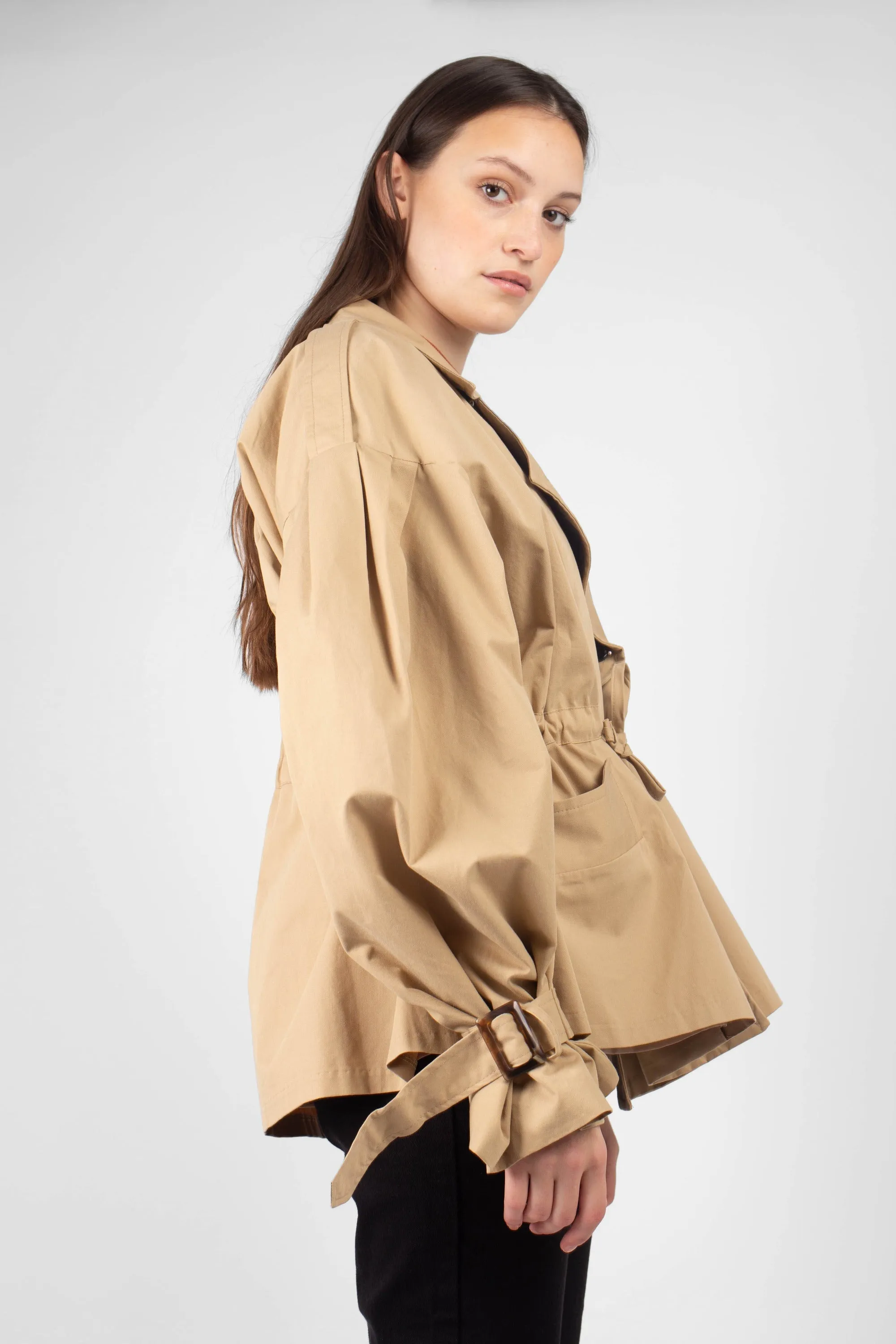 Beige double breasted half length trench coat